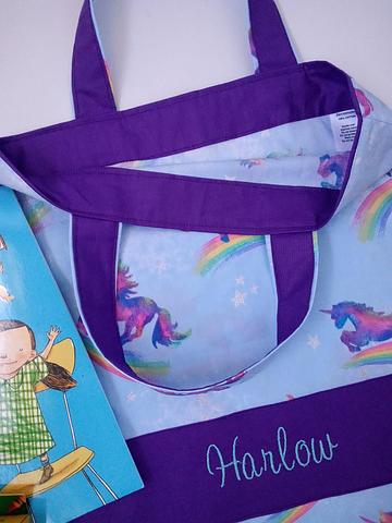 personalised embroidery library bag with childs name and handles unicorn blue
